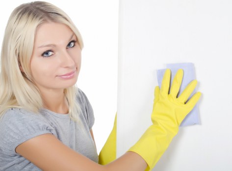 Cleaning products and protective gear prepared for safe carpet cleaning